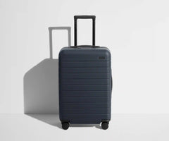 The Bigger Carry-On Flex in Navy Blue